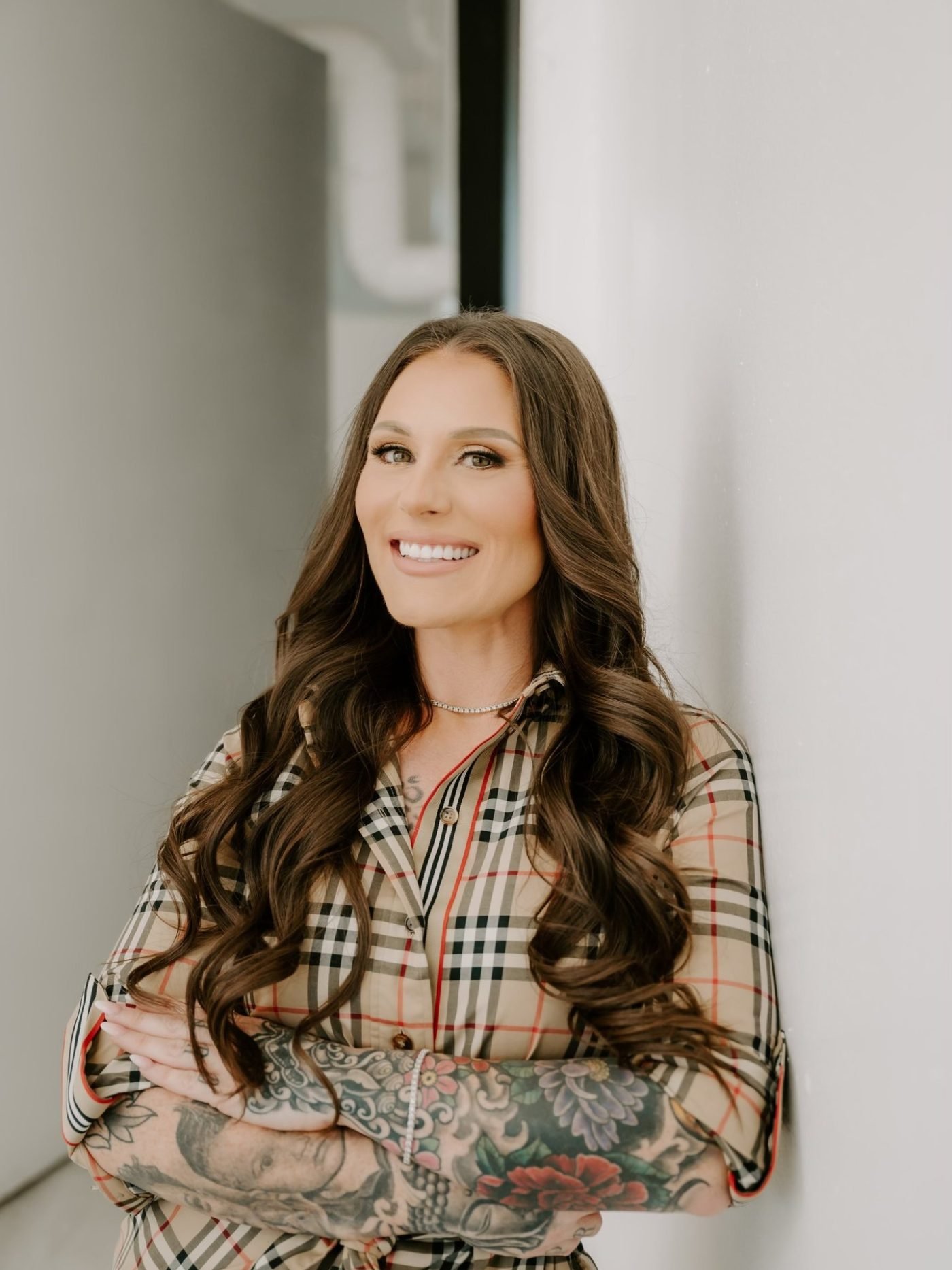 Ashley Matteson, founder of Messy Buns Organized Spaces, in a client's organized closet