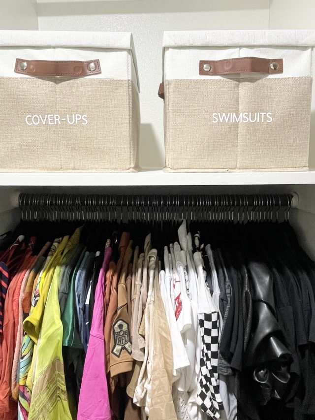 Fabric bins labeled cover-ups and swimsuits above a packed hanging rod