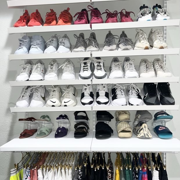 Six shelves of sneakers above a row of hanging activewear and printed leggings