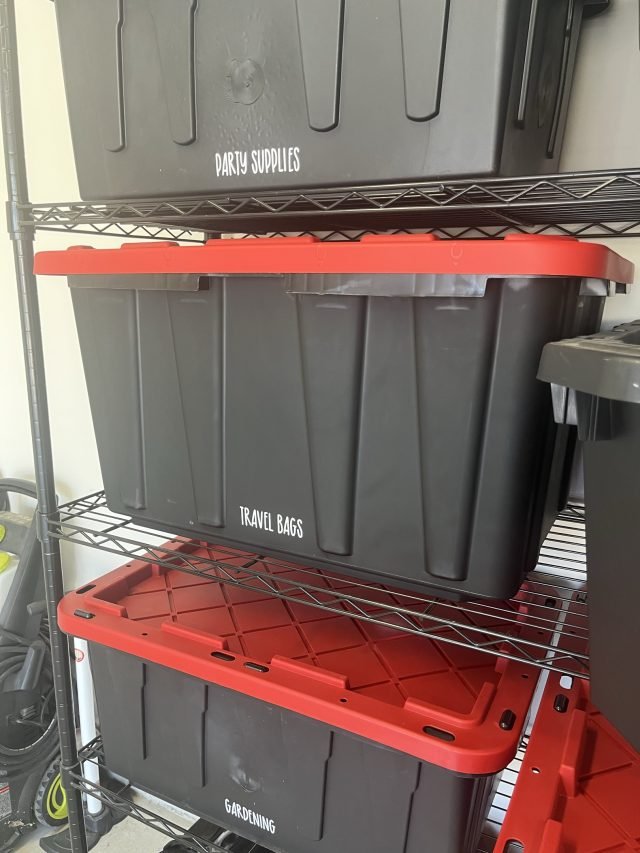 Wire shelving holding labeled totes for bath supplies and travel bags