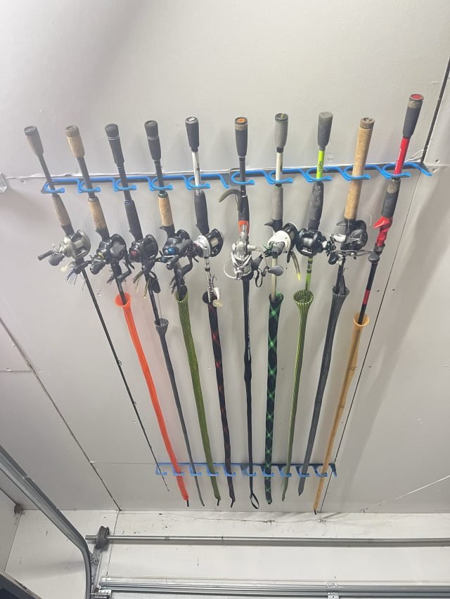 Fishing rods hung from a ceiling rack above the garage door