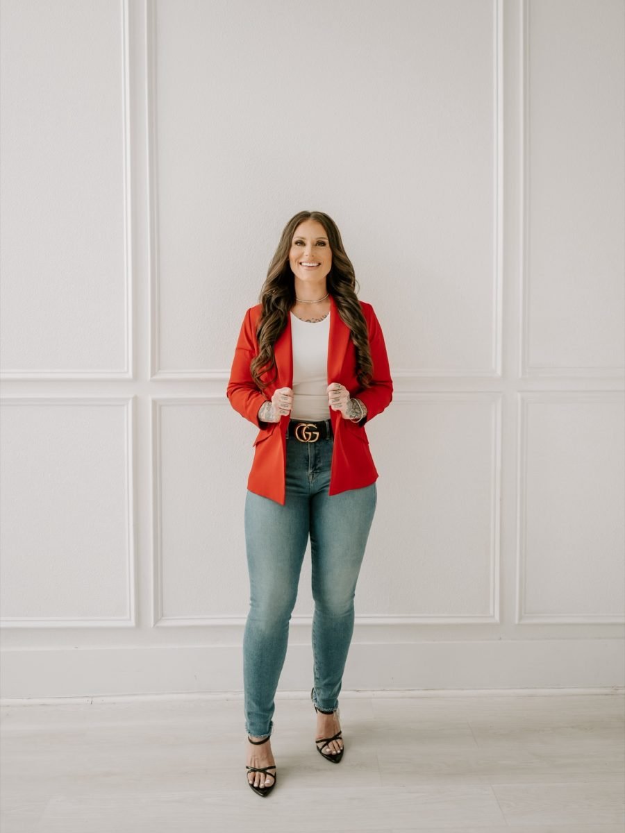 Ashley Matteson, owner of Messy Buns Organized Spaces, in a red blazer